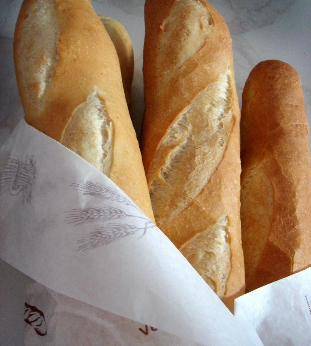 French Bread Loafs - Delicious Cupcake with Frosty - The Role of Precision Handling in the Bakery Process