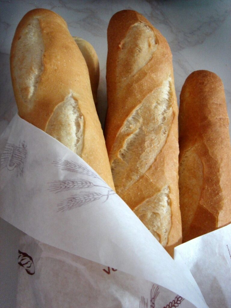 French Bread Loafs - Delicious Cupcake with Frosty - The Role of Precision Handling in the Bakery Process